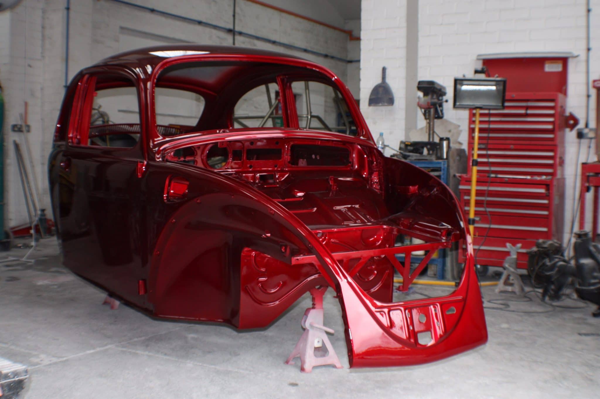 Beetle paint protection film in workshop - red